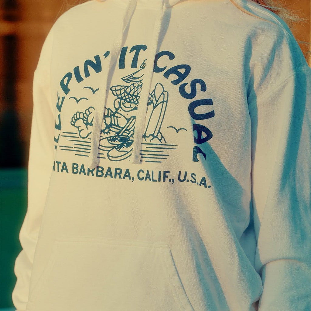 Close up of the Keepin' It Casual graphic on the back of a white hoodie