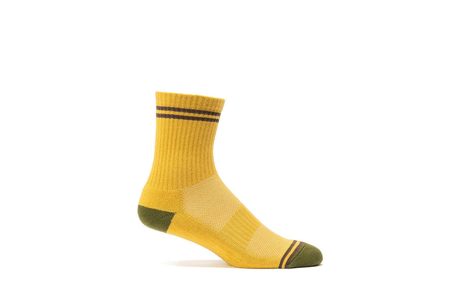 Mustard yellow crew sock with olive heel and toe, side view