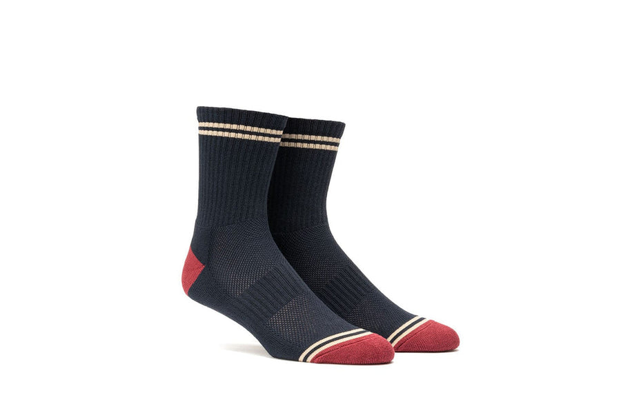 Navy crew socks with burgundy heel and toe, quarter view
