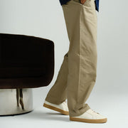 Men's Diamond Cup sneaker in Black leather, ecru pair worn with khaki pants, side view