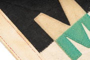 Close up of teal and cream stitched lettering on the Malibu felt pennant