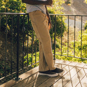 Men's Hawthorne Slip On in Elmwood leather, worn with khaki pants on a balcony deck