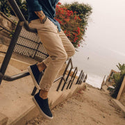 Men's Huntington Middie sneaker in Deep Navy suede, worn with khaki pants on beach access stairs