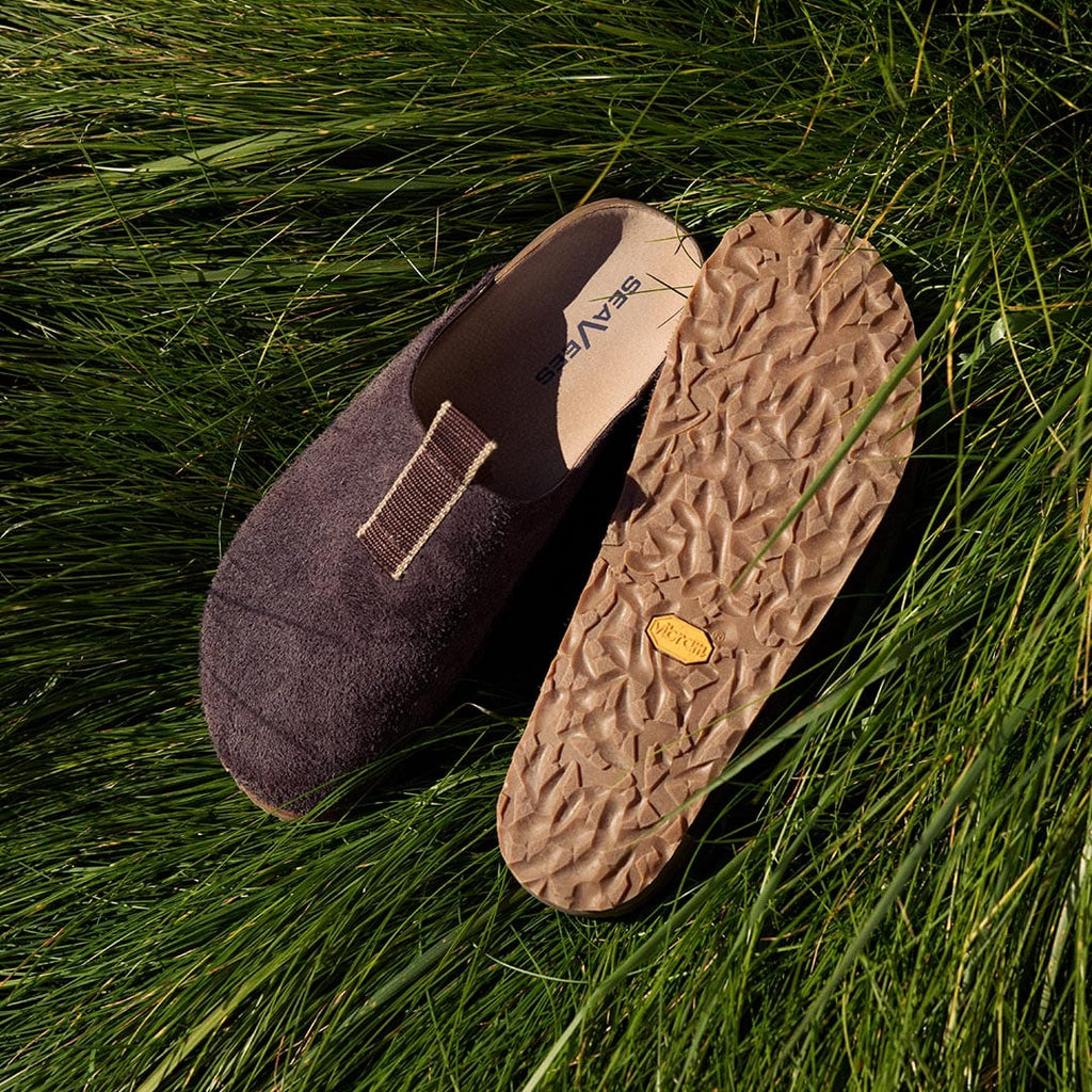Men's Tiburon Trekker sandal in Espresso suede, pair in grass, one showing the Vibram outsole