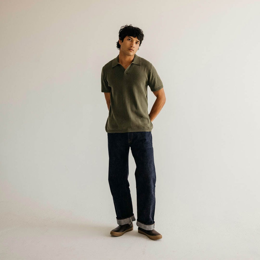 Men's Hawthorne Slip On in Kona leather, full-length view worn with an olive shirt and dark jeans against a white backdrop