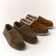 Men's Lodge Slipper in Woodsmoke suede, three pairs stacked on a white background