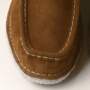 Men's Lodge Slipper in Nutmeg suede, toe close up showing the stitching and shearling trim