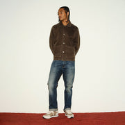 Men's Royal Runner sneaker in Latte nylon and suede, worn by a person standing on a red carpet in a brown jacket
