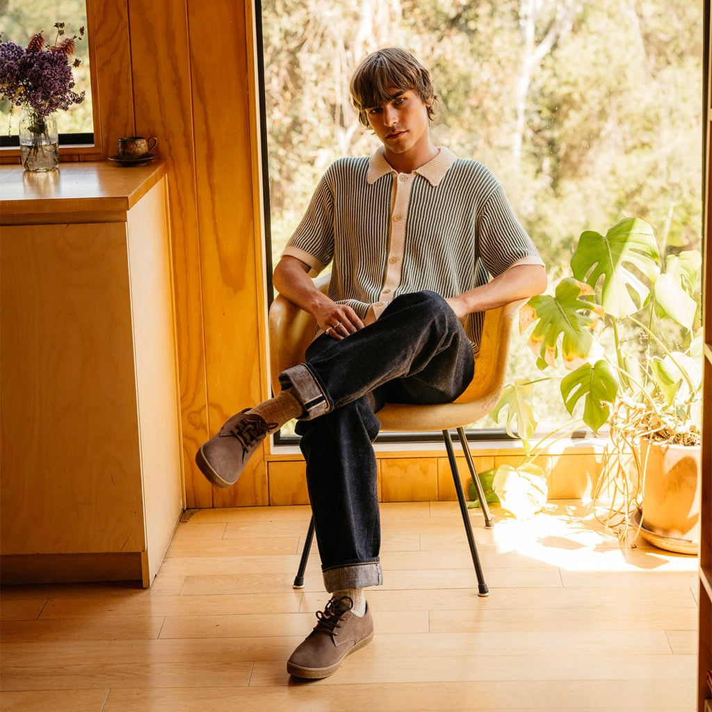 Men's Sun-tans Buck in Fossil suede, worn with dark jeans by a person seated in a sunlit room