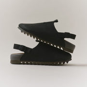 Men's Tahoe Trekker sandal in Black leather, pair stacked on a light background, showing the strap and lug sole