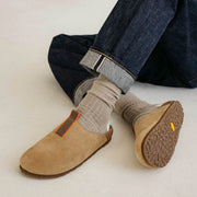 Men's Tiburon Trekker sandal in Maple suede, outsole view worn with rolled jeans and gray socks