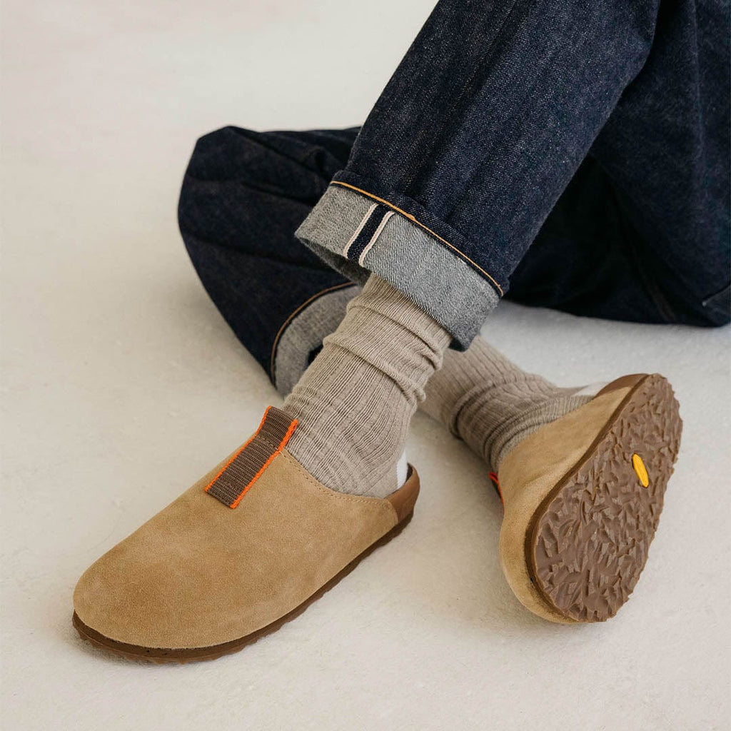 Men's Tiburon Trekker sandal in Maple suede, outsole view worn with rolled jeans and gray socks