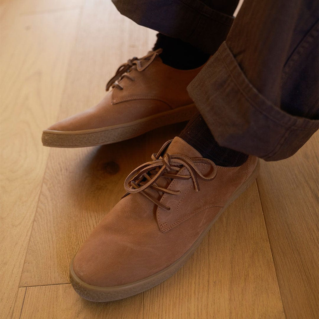 Men's Sun-tans Buck in Timber leather, pair on a wood floor, worn with cuffed pants