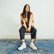 Women's Sato Oxford in Parchment canvas, worn by a woman seated on a chair