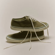 Men's Founders Edition Yacht Shoe in Green canvas, pair stacked with cream laces on a gray background