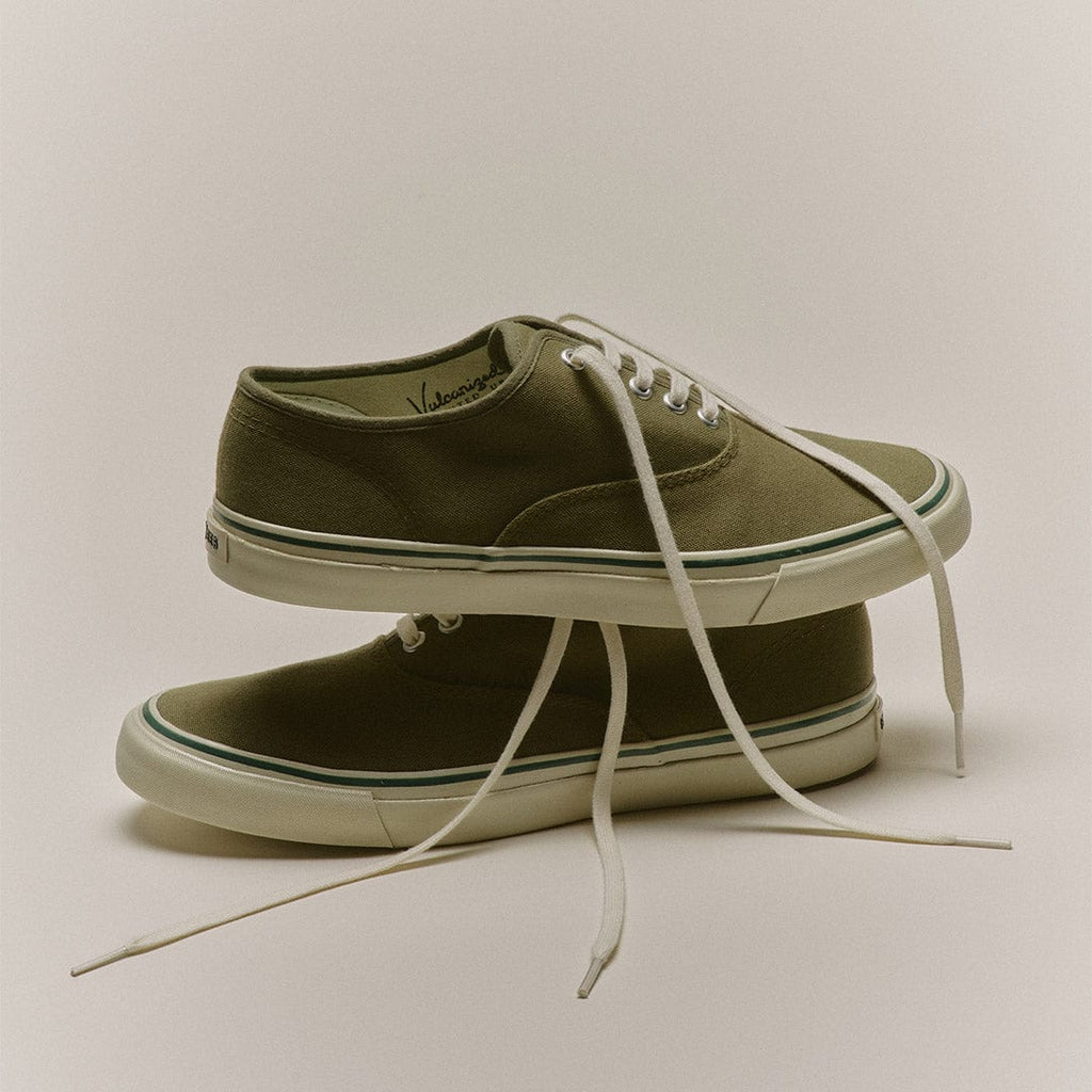 Men's Founders Edition Yacht Shoe in Green canvas, pair stacked with cream laces on a gray background
