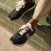 Men's Royal Runner sneaker in Black nylon and suede, close-up with laces and stripe detail, worn