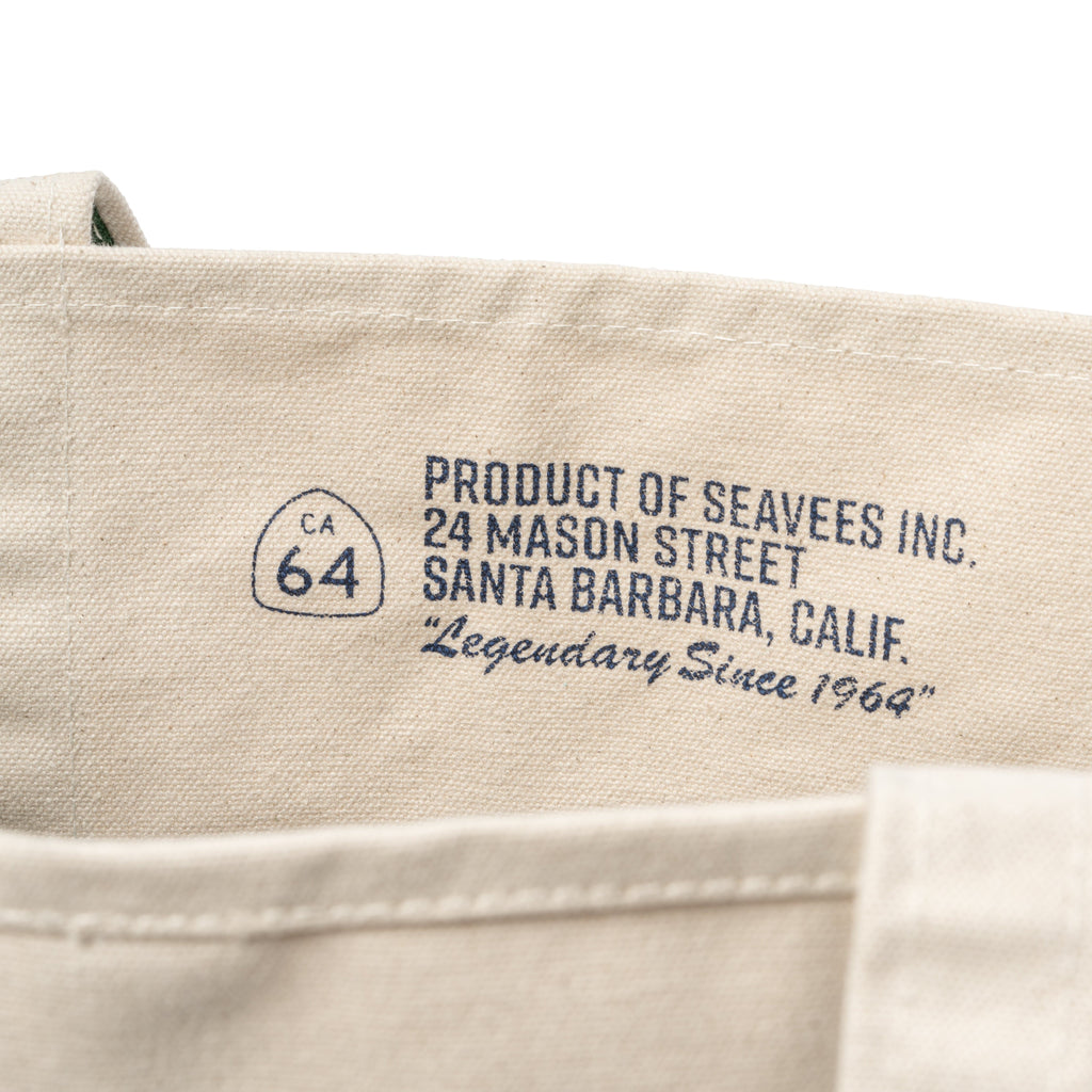 Close up of the printed SeaVees label inside a natural canvas tote bag