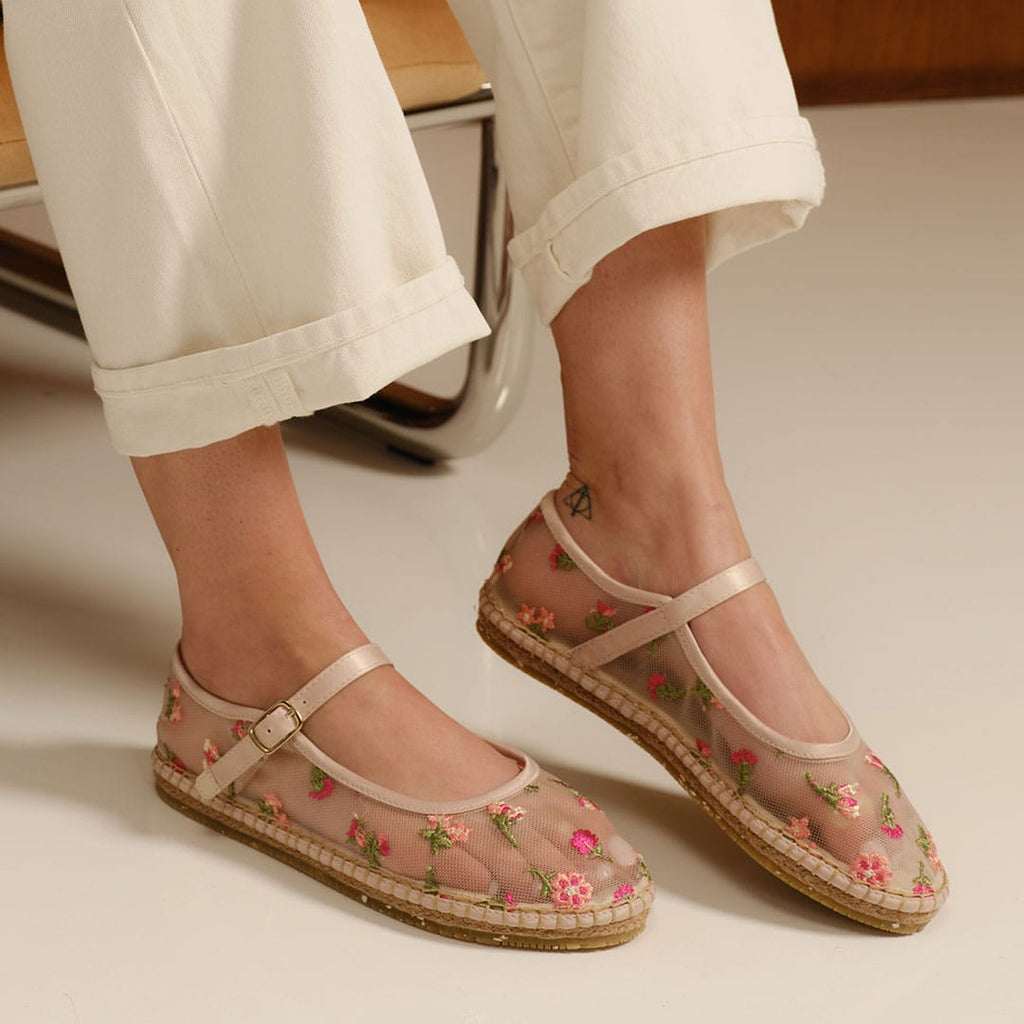 Women's Miramar Espadrille in Bloom mesh, worn with cuffed cream pants, showing the floral embroidery