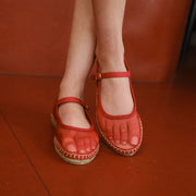 Women's Miramar Espadrille in Forever Red mesh, worn against a red wall, close up