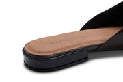 Women's Sadie Slide in Dark Chocolate rubber, close-up of the heel showing the tan footbed and dark sole