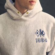 Close up of the 1964 signal flag chest graphic on an oatmeal hoodie