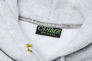 Inside neck of a heather gray hoodie with Camber label