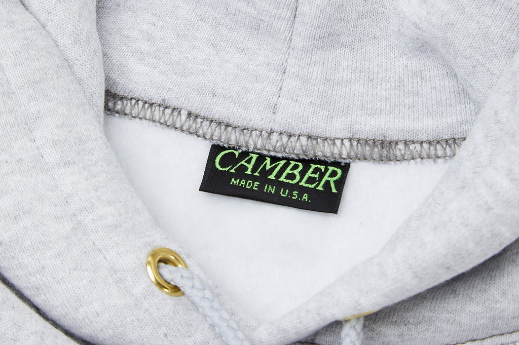 Inside neck of a heather gray hoodie with Camber label