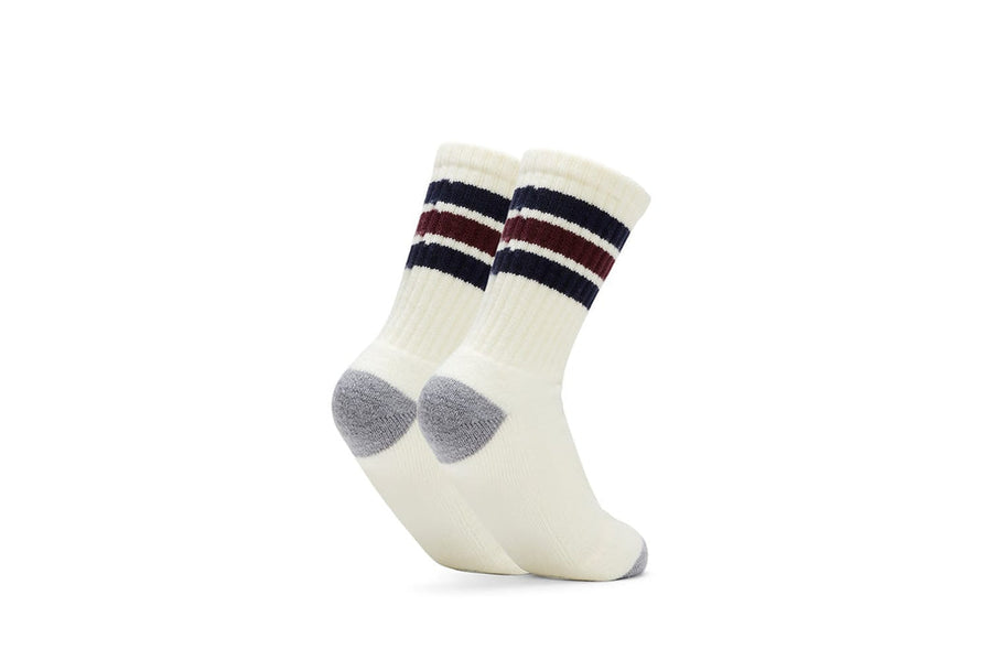 Ivory crew socks with navy and burgundy stripes and gray heel, back view