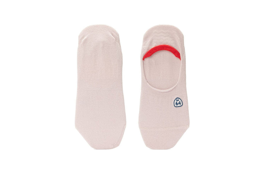 Women's Hideaways no-show socks in pink with red heel trim, top view
