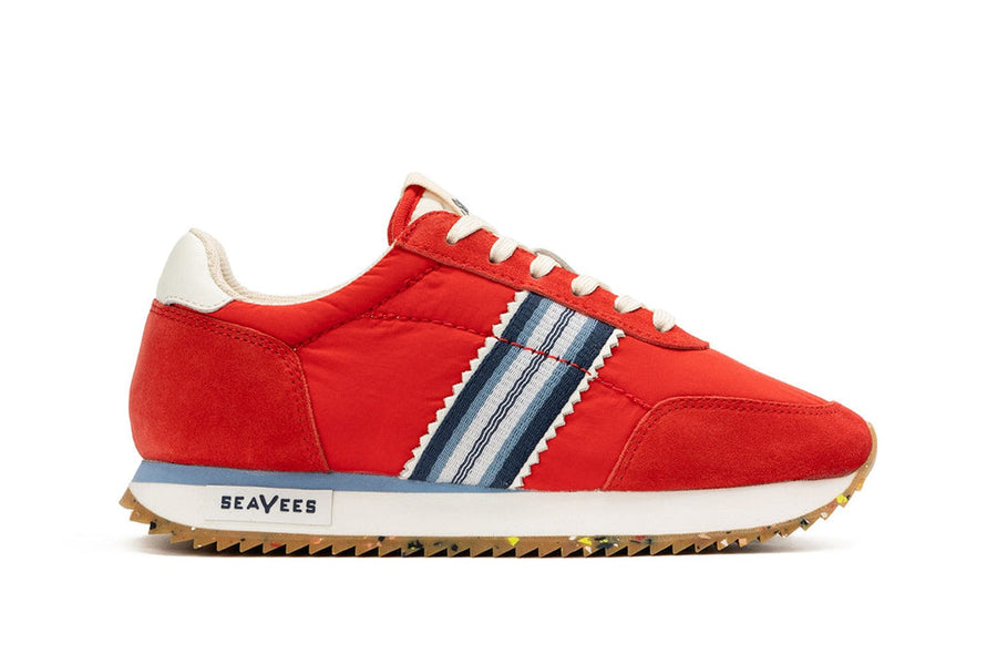 Side view of Royal Runner sneaker in strawberry, featuring SeaVees logo and recycled bottom.